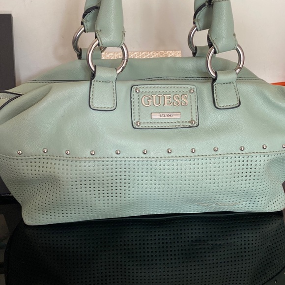 Guess Handbags - It’s original Guess bag I had hardly used it six months that do not continues